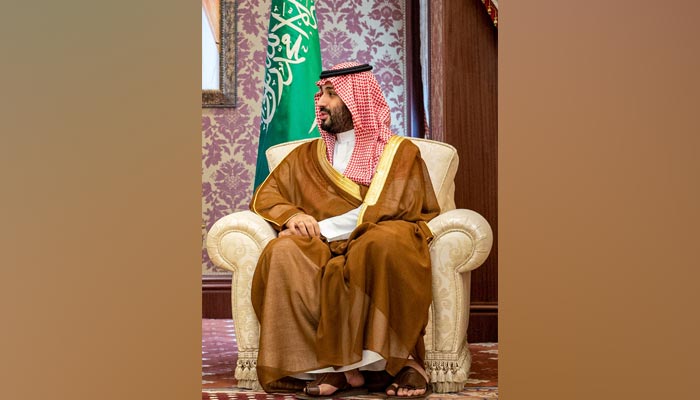 This handout picture provided by the Saudi Royal Palace shows Saudi Crown Prince Mohammed bin Salman receiving Germanys Chancellor at al-Salam Palace in the Red Sea coastal city of Jeddah on September 24, 2022. — AFP/File