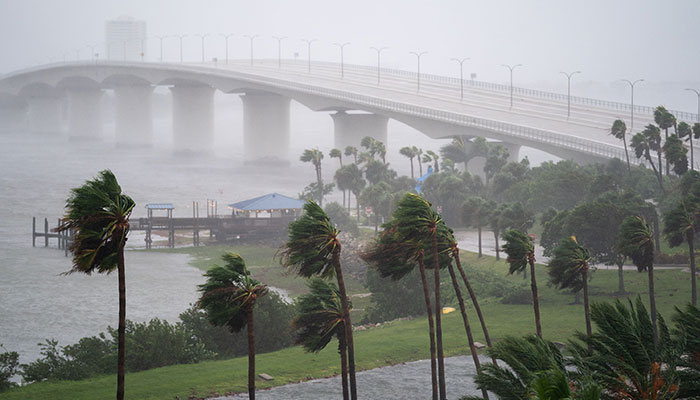 Wind gusts blow across the John Ringling Causeway as Hurricane Ian churns to the south on September 28, 2022 in Sarasota, Florida. — AFP