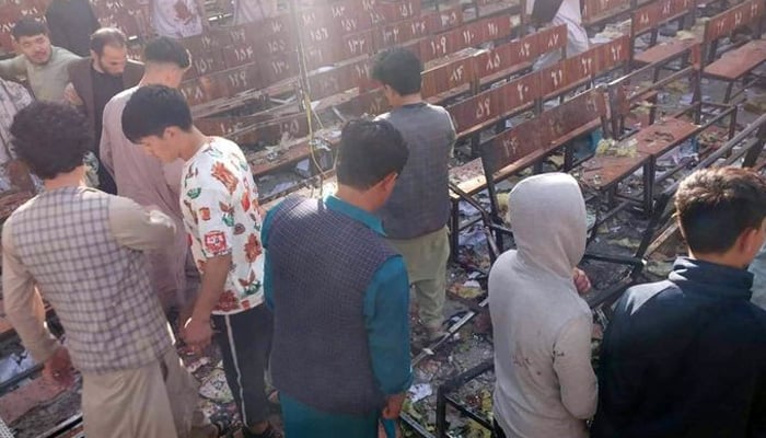People gather at the blast site after a suicide attack at an education centre in Kabuls Dasht-e-Barchi neighbourhood. Courtesy Tolo News