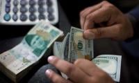 PKR gains further against dollar after speculators warned of action