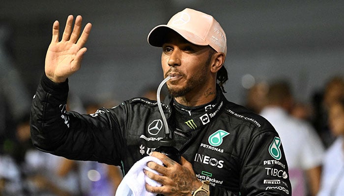 Mercedes´ British driver Lewis Hamilton reacts after placing third in the qualifying session ahead of the Formula One Singapore Grand Prix night race at the Marina Bay Street Circuit in Singapore on October 1, 2022. — AFP