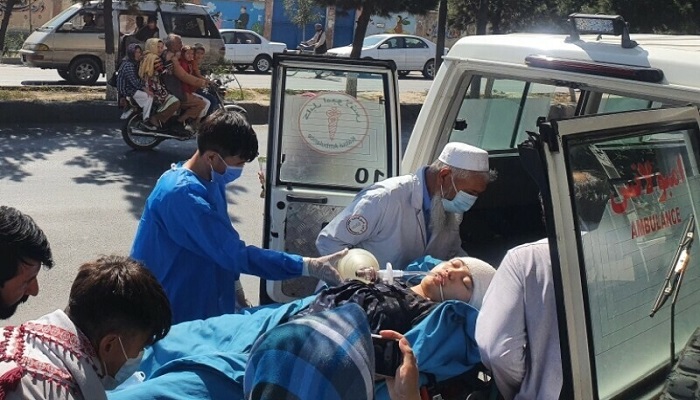 Relatives and medical staff move a wounded girl from an ambulance outside a hospital in Kabul following a suicide bombing at a learning centre in the Dasht-e-Barchi area of the Afghan capital. — AFP