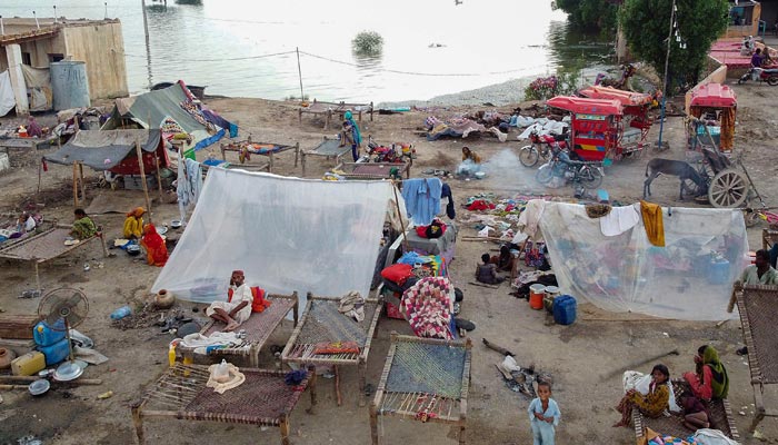 Several people displaced because of the floods are living in makeshift camps. — AFP