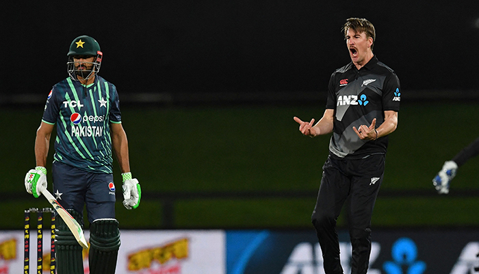 New Zealands Blair Tickner (R) celebrates the wicket of Pakistans Shan Masood during the second cricket match between New Zealand and Pakistan in the Twenty20 tri-series at Hagley Oval in Christchurch on October 8, 2022. — AFP