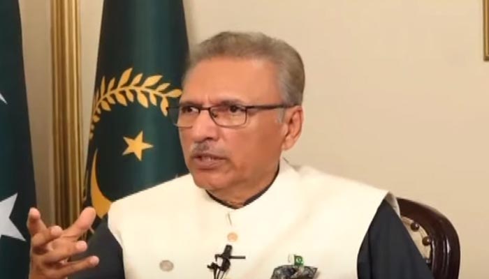 President Arif Alvi talks during an interview with a private news channel. — Aaj TV/YouTube