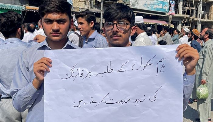 Students and teachers of private schools take part in a protest against recent attack in Mingora on October 10, 2022. — AFP