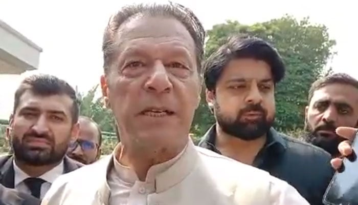 Former Pakistan Prime Minister Imran Khan leaves after appearing before the High Court in Islamabad on October 12.  - Twitter Video Screengrab