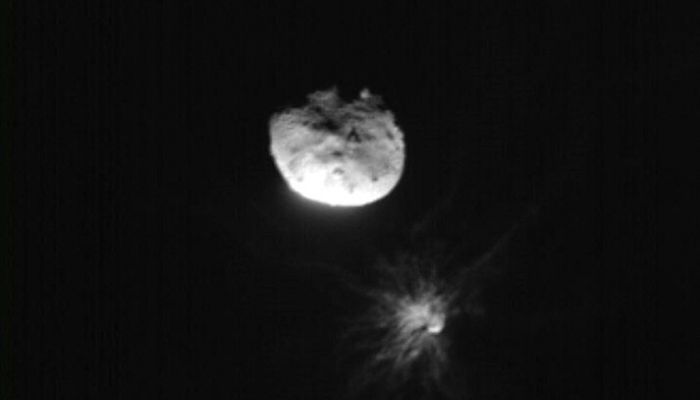 This handout picture obtained by the Italian Space Agencyâ€™s LICIACube shows the NASA´s Double Asteroid Redirection Test (DART) mission just before its closest approach to the Dimorphos asteroid, on September 26, 2022.— AFP