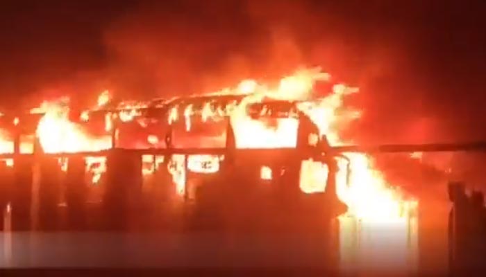 A still image of the passenger bus that caught fire near Nooriabad on October 12, 2022. — Twitter/@SibteHR