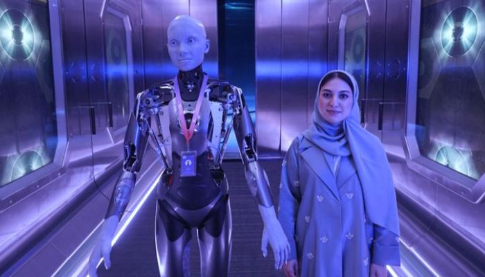 Humanoid robot Ameca standing with human Aya.— Gulf News