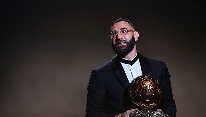 Real Madrid´s French forward Karim Benzema receives the Ballon d´Or award during the 2022 Ballon d´Or France Football award ceremony at the Theatre du Chatelet in Paris on October 17, 2022. — AFP