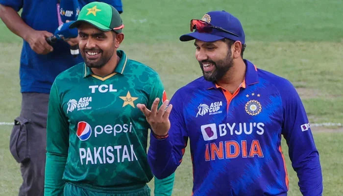 Pakistan skipper Babar Azam (Left) and Indian team captain Rohit Sharma are seen in a good mood. — PCB