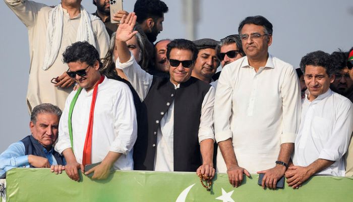 Former prime minister Imran Khan, center, waves at his party supporters during a rally in Islamabad on May 26, 2022. — AFP