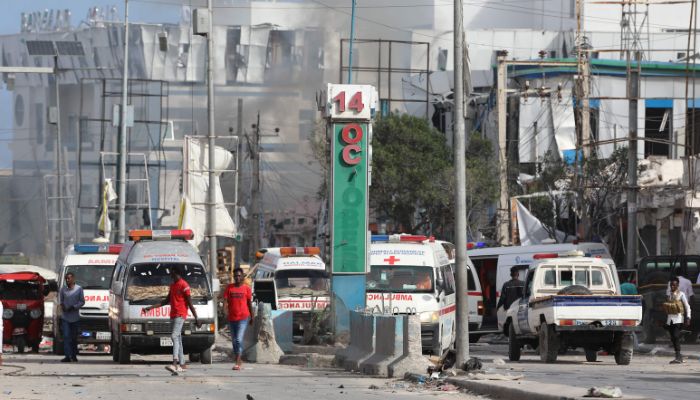 Security personnel and ambulances are stationed near destroyed and damaged buildings after an car bombing targeted the education ministry in Mogadishu on October 29, 2022.— AFP