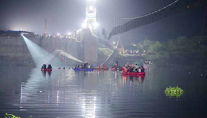 Indian rescue personnel conduct search operations after a bridge across the river Machchhu collapsed in Morbi, some 220 kms from Ahmedabad, early on October 31, 2022. — AFP/File