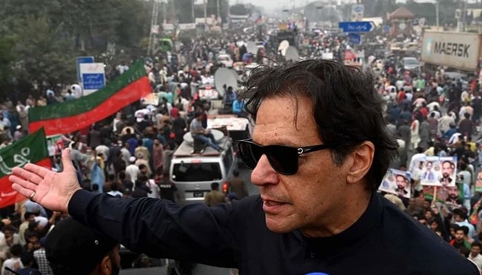 In this photograph taken on November 1, 2022, Pakistans former prime minister Imran Khan speaks while taking part in an anti-government march in Gujranwala. — AFP
