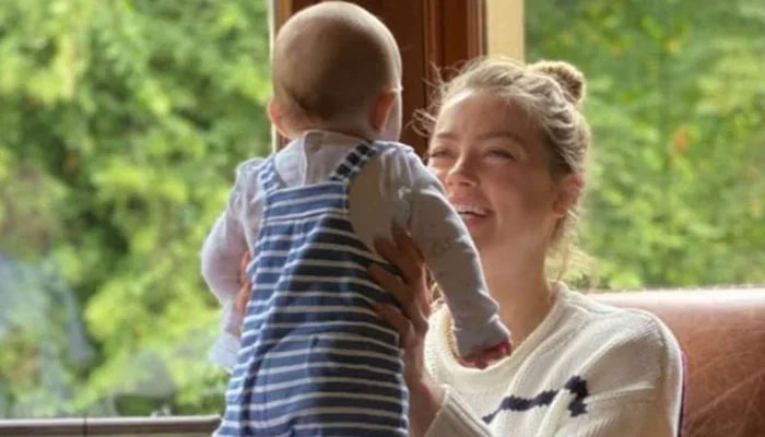 Exhausted Amber Heard leaves US to just be a mom to Oonagh