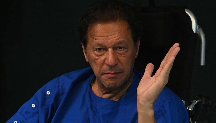 Former prime minister Imran Khan talks with media representatives at a hospital in Lahore on November 4, 2022, a day after an assassination attempt on him during his long march near Wazirabad. — AFP