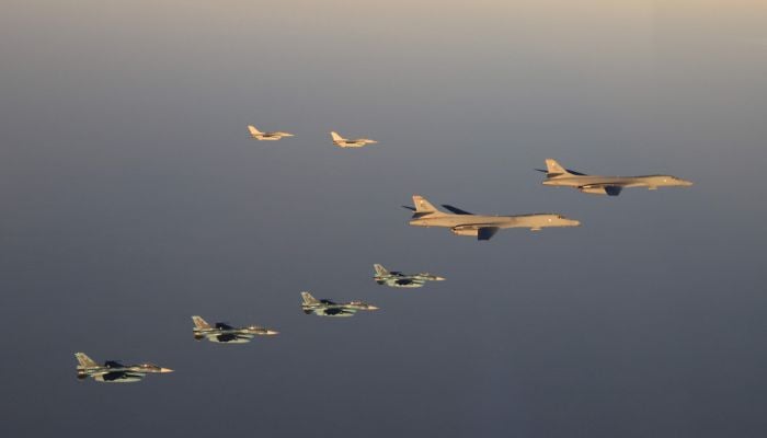 This handout photo taken on November 5, 2022 and released by Japan´s Ministry of Defense shows members of the Japan Air Self-Defense Force (JASDF) and the US participating in a bilateral military exercise in the skies over Kyushu island. North Korean forces said they would respond to joint exercises by the US and South Korea with sustained, resolute and overwhelming military measures, its state media reported on November 7, 2022.— AFP