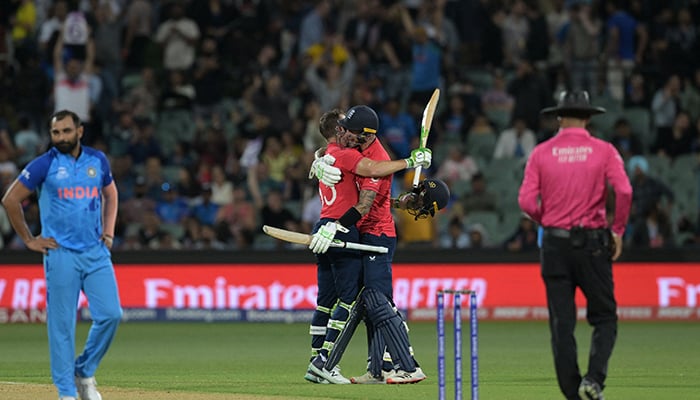 Englands Alex Hales (R) and Englands Captain Jos Buttler (L) celebrate after victory in the ICC mens Twenty20 World Cup 2022 semi-final cricket match England and India at The Adelaide Oval in Adelaide on November 10, 2022. — AFP
