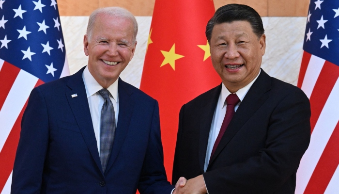 US President Joe Biden (R) and China´s President Xi Jinping (L) shake hands as they meet on the sidelines of the G20 Summit in Nusa Dua on the Indonesian resort island of Bali on November 14, 2022. — AFP