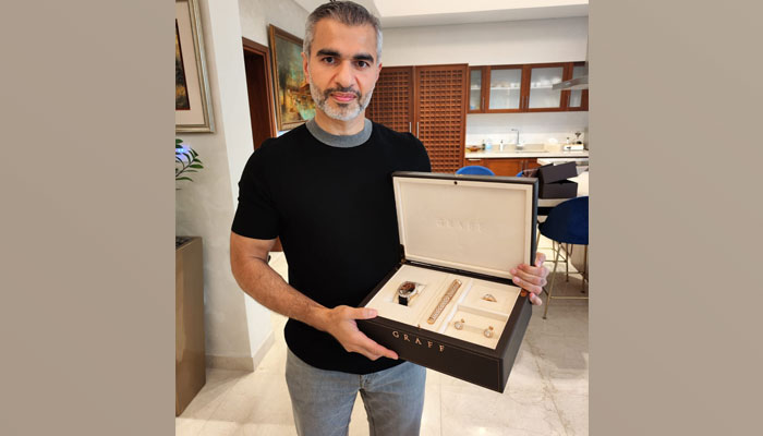 Zahoor, the Norwegian-Pakistani millionaire poses with the gifts that he bought from Farah Gogi. — Exclusive picture provided by author