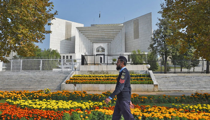 A policeman walks past the Supreme Court building in Islamabad, Pakistan. — AFP/File