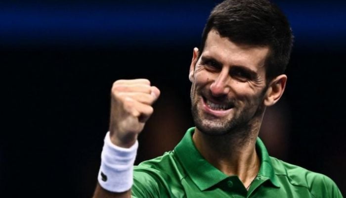 Novak Djokovic celebrates after winning his first round-robin match against Greeces Stefanos Tsitsipas at the ATP Finals.— AFP