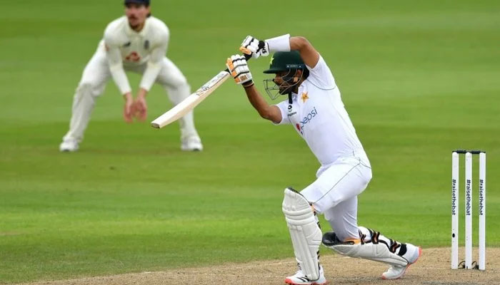 Elegant fifty — Pakistans Babar Azam drives on the first day of the first Test against England at Old Trafford. — AFP/File