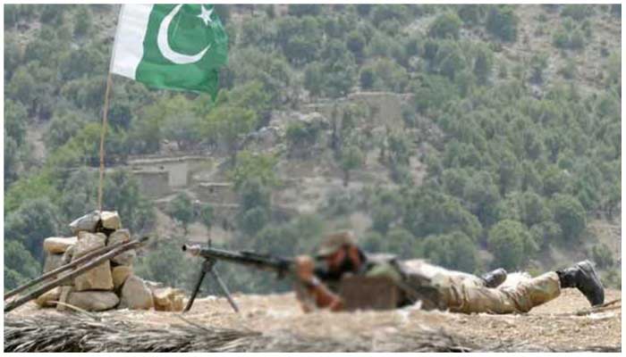 Image showing a Pakistan Army soldier taking a position before opening fire. — ISPR/file