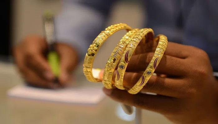 Gold bangles. —  AFP/File