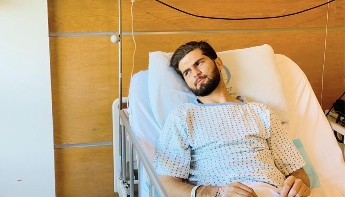 Pakistan paceman Shaheen Shah Afridi is seen lying on a hospital bed. — Twitter