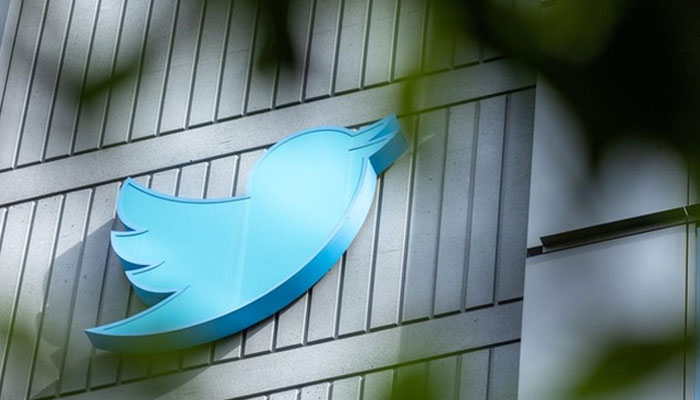 The Twitter logo appears on a sign on the outside of Twitter's headquarters in San Francisco, California, on October 28, 2022. - AFP