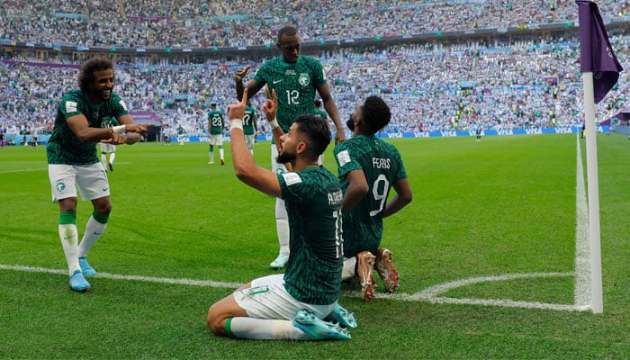Saudi Arabias forward #11 Saleh Al-Shehri celebrates after scoring his teams first goal during the Qatar 2022 World Cup Group C football match between Argentina and Saudi Arabia at the Lusail Stadium in Lusail, north of Doha on November 22, 2022. — AFP