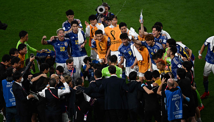 Japans players celebrate their win in the Qatar 2022 World Cup Group E football match between Germany and Japan at the Khalifa International Stadium in Doha on November 23, 2022. — AFP