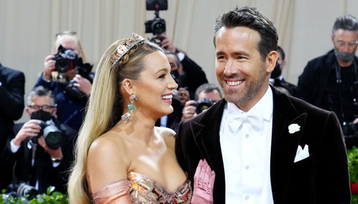 Blake Lively playfully flirts with husband Ryan Reynolds as he shares dance moves from Spirited