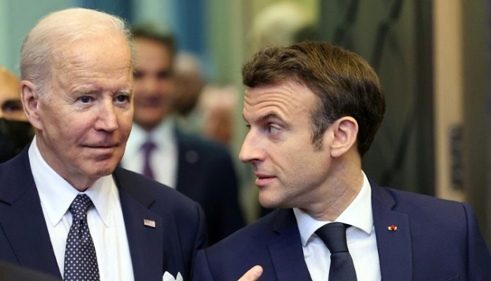 Emmanuel Macron (R) will be the first French president to be welcomed for two US state visits. - AFP
