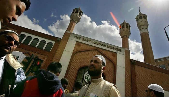 Muslim worshippers gather for Friday prayer on the streets outside the mosque of the Muslim centre in east London. — AFP/File