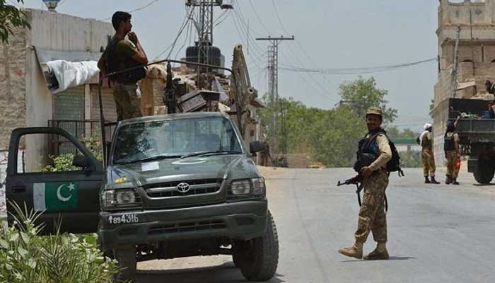 Soldiers stand guard at a checkpoint. — AFP/File