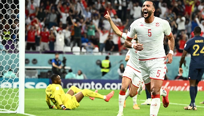 Tunisias defender #05 Nader Ghandri celebrates after scoring his teams first goal which was ruled out for off side during the Qatar 2022 World Cup Group D football match between Tunisia and France at the Education City Stadium in Al-Rayyan, west of Doha on November 30, 2022. — AFP