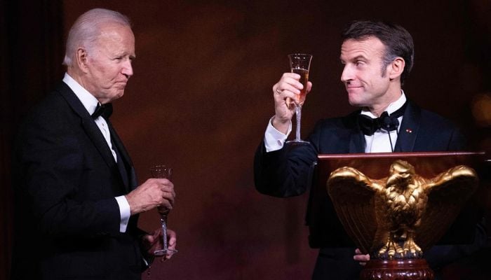 French President Emmanuel Macron toasts US President Joe Biden during a state dinner on the South Lawn of the White House in Washington, DC, on 1 December, 2022.— AFP