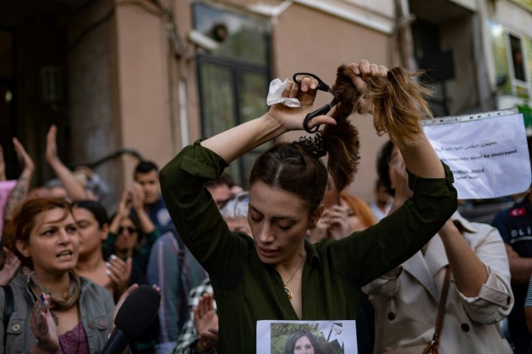 Support for Iranian protesters have spread worldwide, with women cutting their hair in solidarity. — AFP