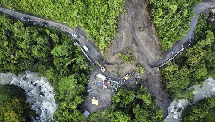Aerial view of a landslide that engulfed a bus and other vehicles.— AFP
