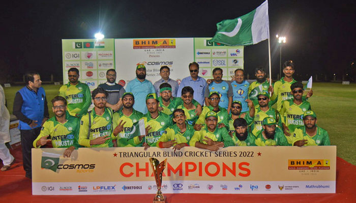 Pakistans blind cricket team poses for a photo after defeating India in the final of a Triangular Blind Cricket T20 Tournament in Sharjah, UAE, on March 19, 2022. — Facebook/@pbcc.official