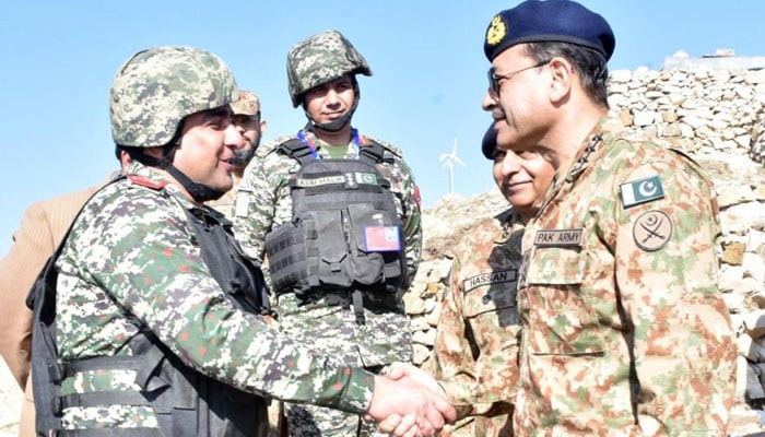 Chief of Army Staff General Asim Munir shakes hands with a soldier at Pakistan-Afghanistan border in Tirah Valley.— ISPR