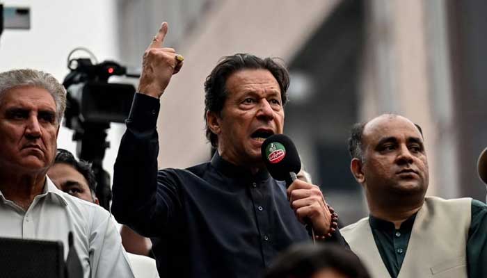 Pakistan Tehreek-e-Insaf Chairman Imran Khan addresses  supporters during an anti-government march towards Islamabad, in Gujranwala on November 1, 2022. — AFP/File