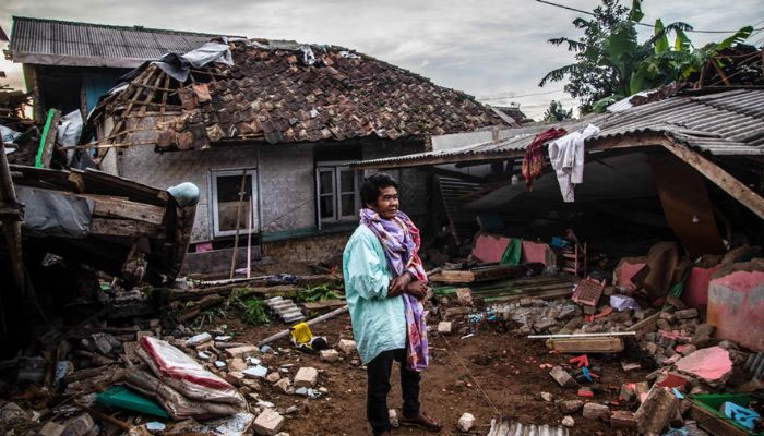 A villager looks at damaged houses following a 5.6-magnitude earthquake that killed at least 162 people in West Java in November. — AFP/File