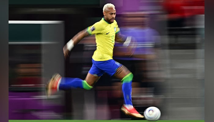 Brazils forward #10 Neymar runs with the ball during the Qatar 2022 World Cup quarter-final football match between Croatia and Brazil at Education City Stadium in Al-Rayyan, west of Doha, on December 9, 2022. — AFP