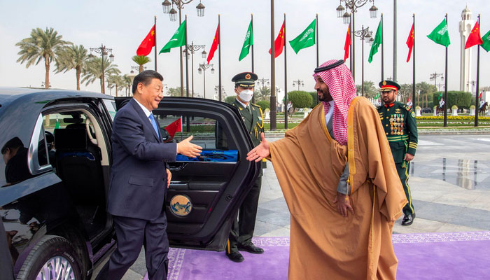 This handout picture provided by the Saudi Royal Palace shows Saudi Crown Prince Mohammed bin Salman welcoming Chinese President Xi Jinping in the capital Riyadh, on December 8, 2022. — AFP