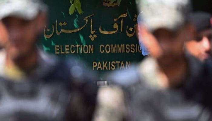 Security personnel stand guard outside the office of the Election Commission of Pakistan. — AFP/File